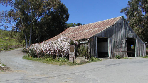 [ Photo of barn and plaque wide. ]
